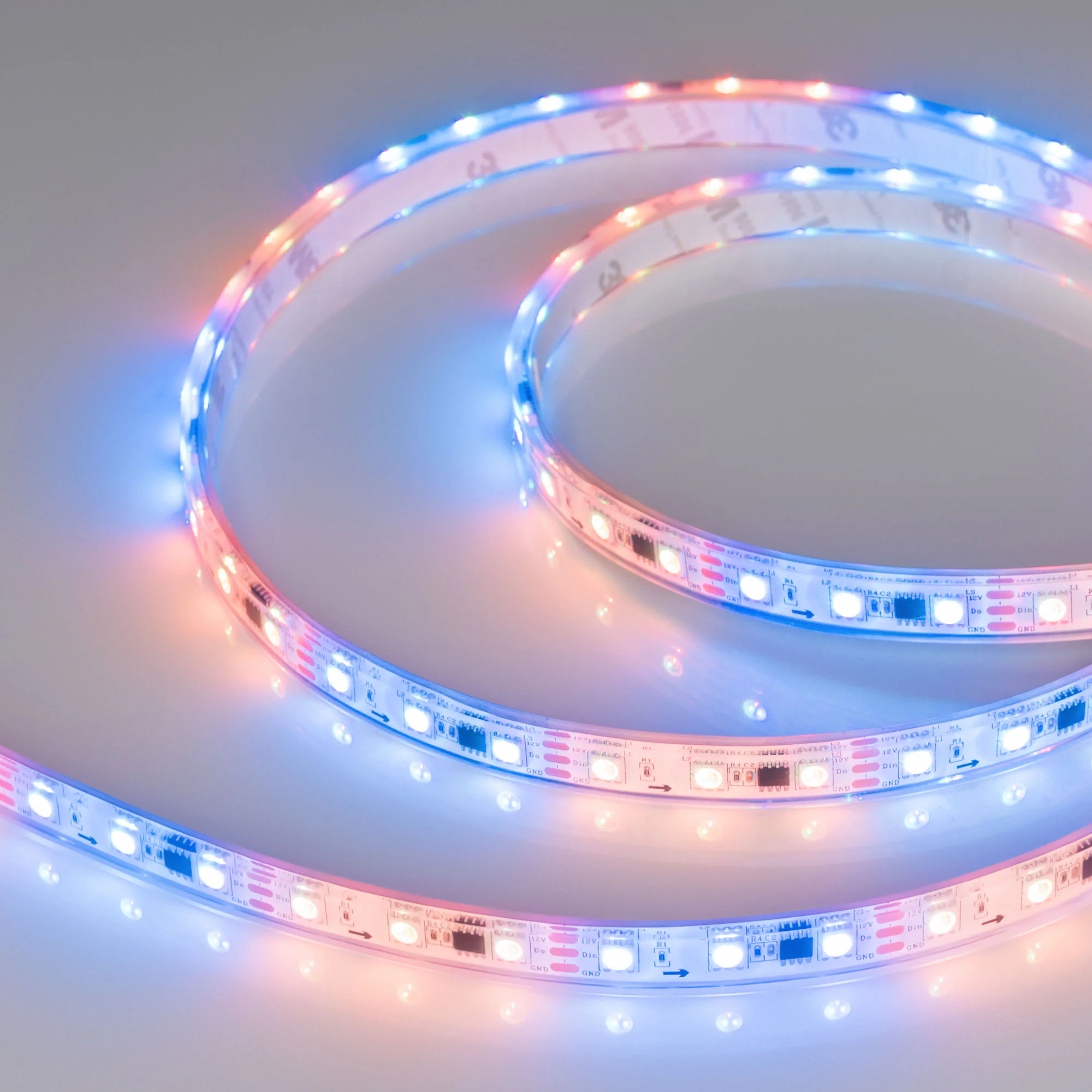 Лента герметичная SPI-P-B60-12mm 12V RGB-PX3 (14.4W/m, IP66, 5060, 5m) 026365(3) - Герметичная лента SPI «Бегущий огонь» с микросхемой 16703, в прозрачной силиконовой трубке (IP66), со СКОТЧЕМ 3M на обрат. стороне. Рекоменд-ся подводка пит-я с 2 сторон ле