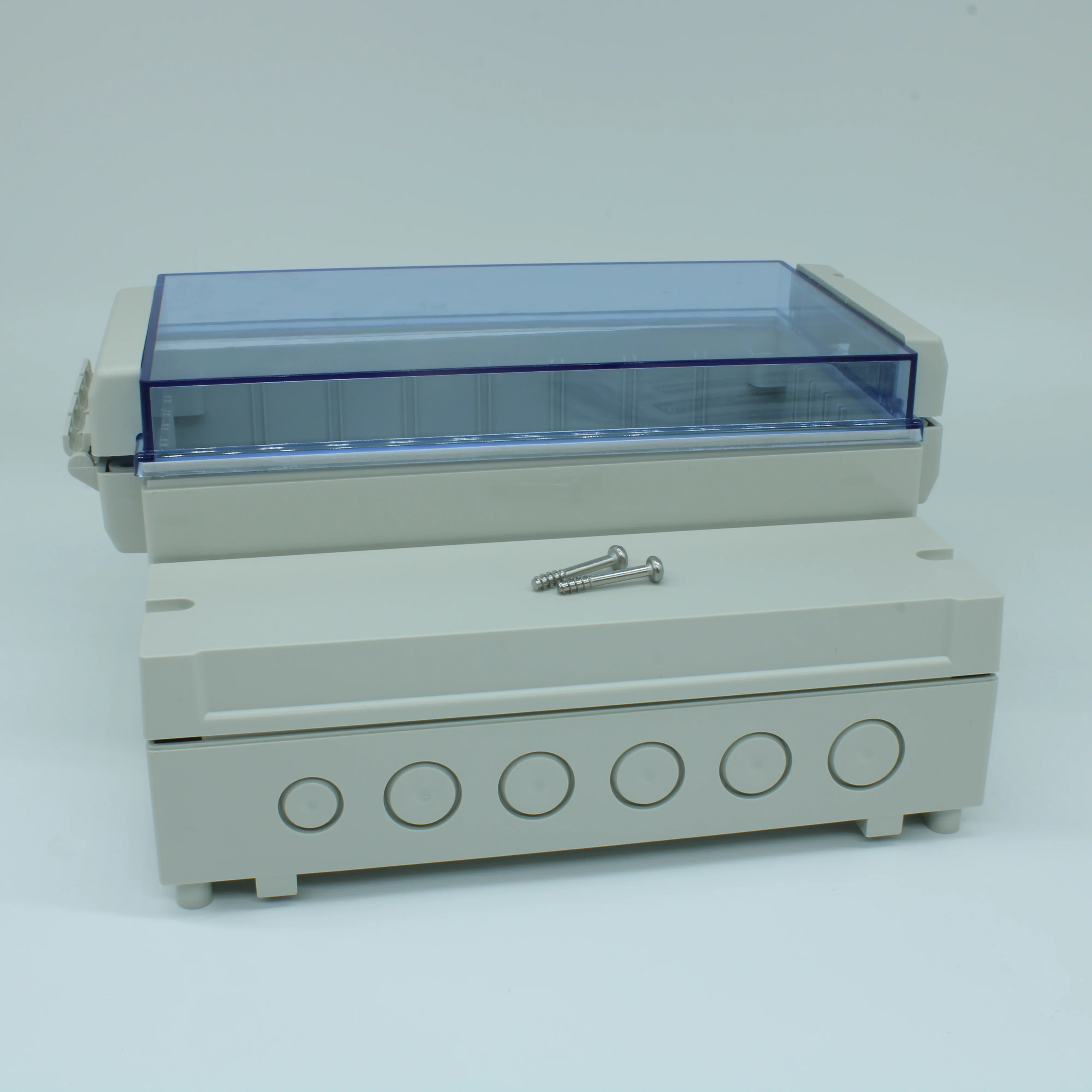 DC005CBU - Двухсекционный корпус IP65 с откидной прозрачной синей крышкой, база ABS светло-серая, крышка из поликарбоната