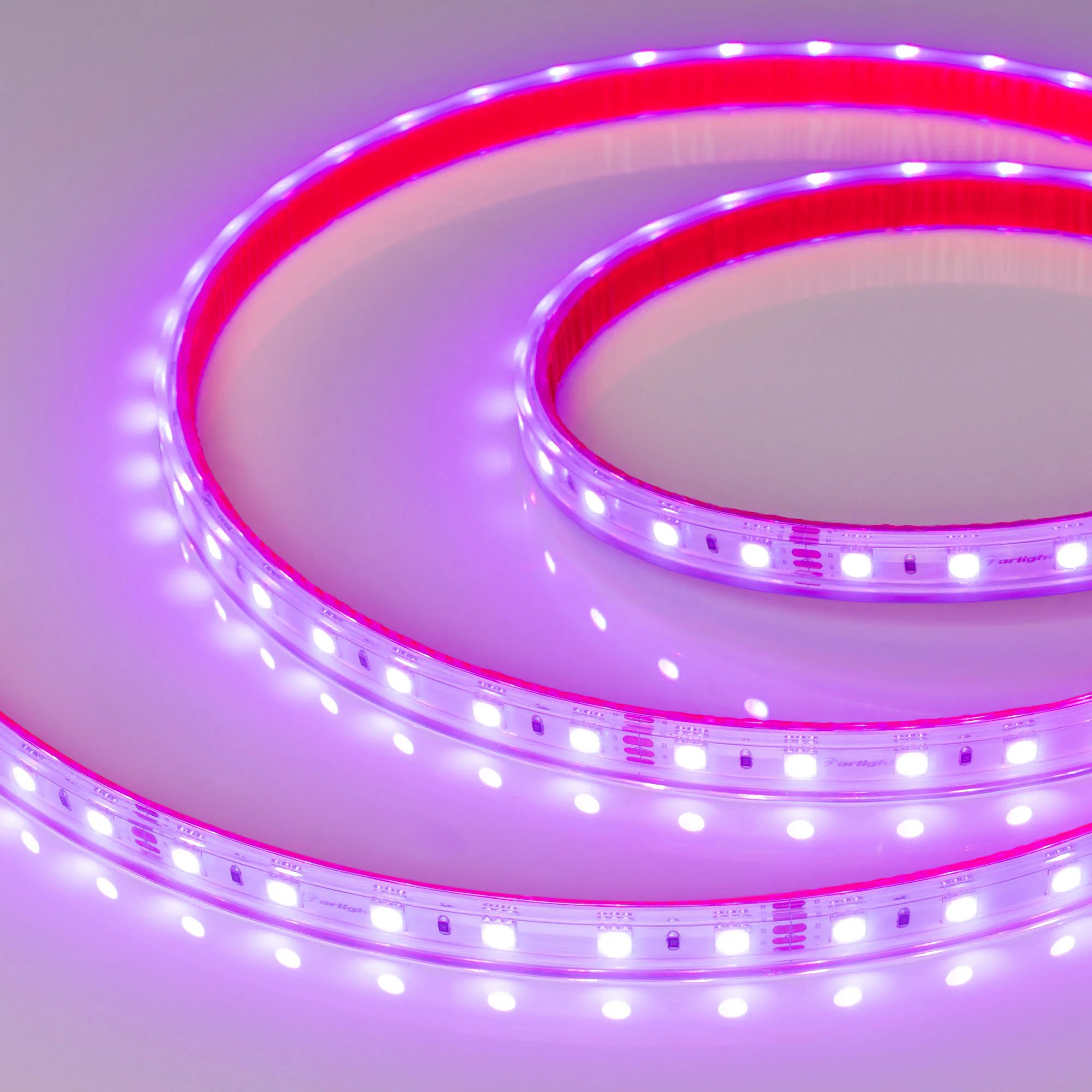 Лента герметичная RTW-PS-B60-12mm 24V RGB (14.4 W/m, IP67, 5060, 5m) 021400(2) - Светодиодная гибкая лента RTW-B60, герметичная IP67 (PS-силиконовая экструзия). Светодиоды 5060, 60 шт/м (300 шт на 5 м), белая плата 12 мм, скотч 3M. Цвет RGB, угол 120°. Пи