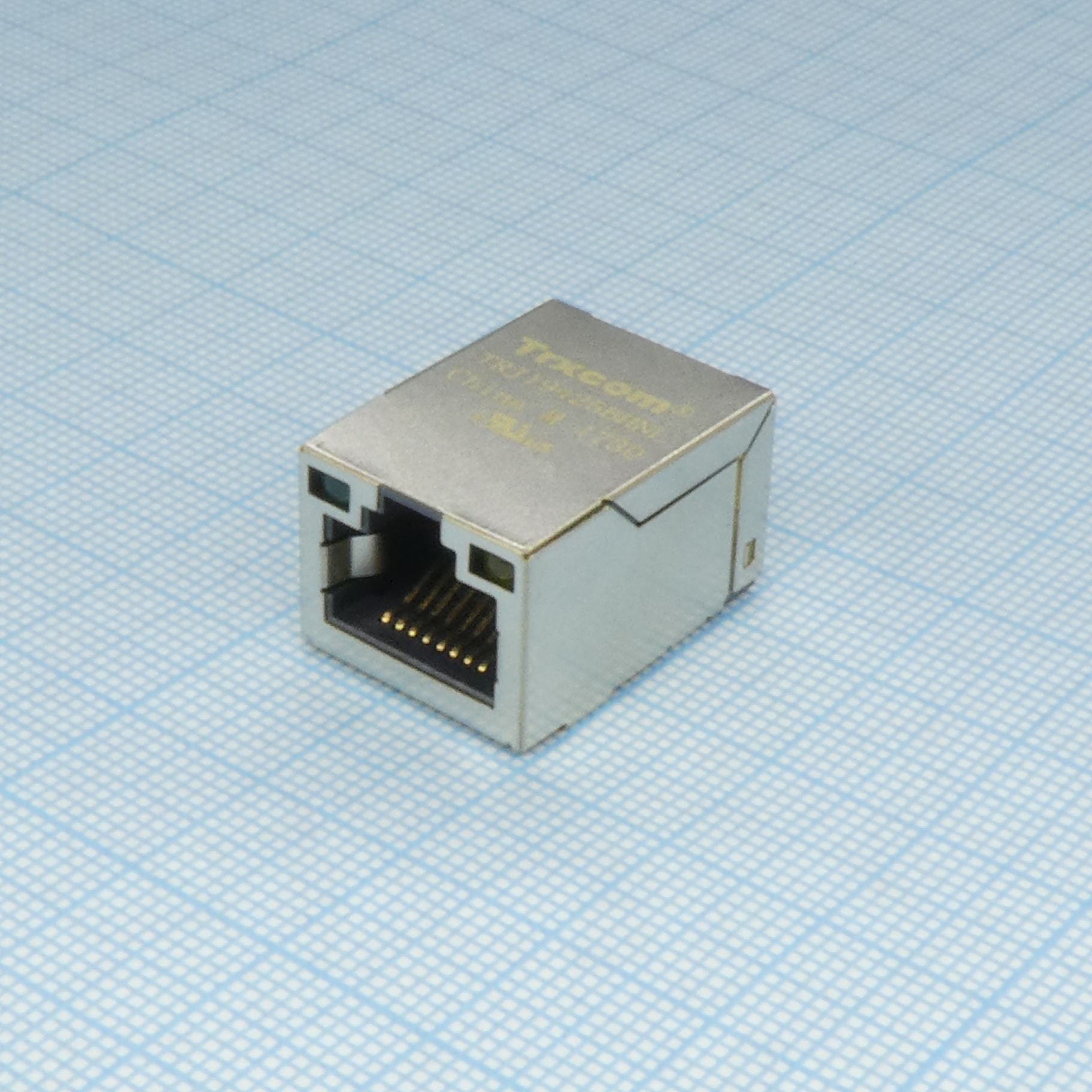 TRJ19425BHNL - Разъем экр. "гнездо" RJ-45 c согласующ. фильтром 10/100Base-TX (1:1), гориз., поверхностн. монтаж на плату (с крепл. "solder nail"), 2 верхн. светодиод. (лев.зел./прав.желт.), без лепестк., от -40...+85°С, Lк. = 23.05 мм, упак. на ленте