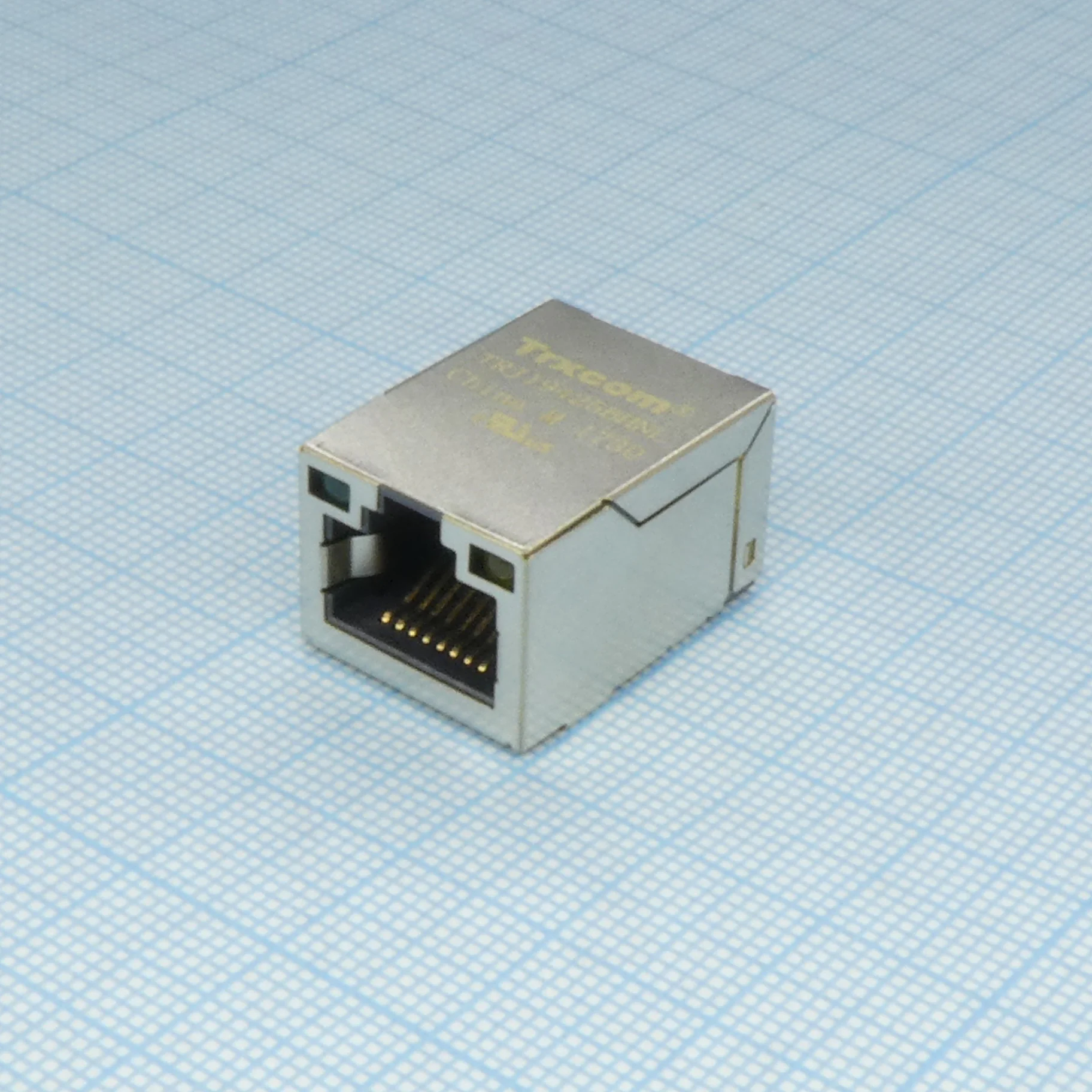 TRJ19425BHNL - Разъем экр. "гнездо" RJ-45 c согласующ. фильтром 10/100Base-TX (1:1), гориз., поверхностн. монтаж на плату (с крепл. "solder nail"), 2 верхн. светодиод. (лев.зел./прав.желт.), без лепестк., от -40...+85°С, Lк. = 23.05 мм, упак. на ленте