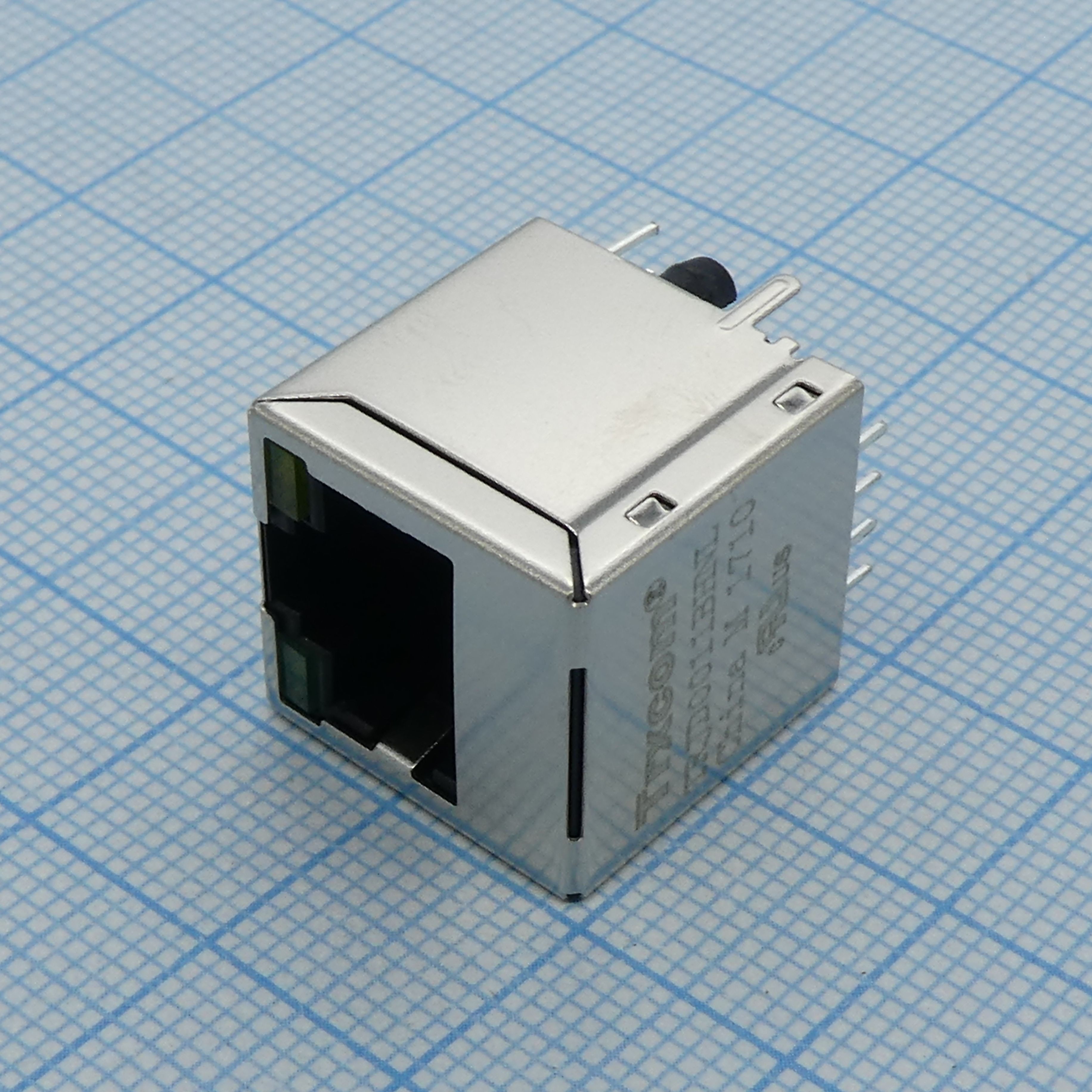 TRJD0011BHNL - Разъем экр. "гнездо" RJ-45 c согласующ. фильтром 10/100Base-TX (1:1), вертик. на плату, 2 светодиод. (зеленый/желтый), без лепестков,  0...+70°С