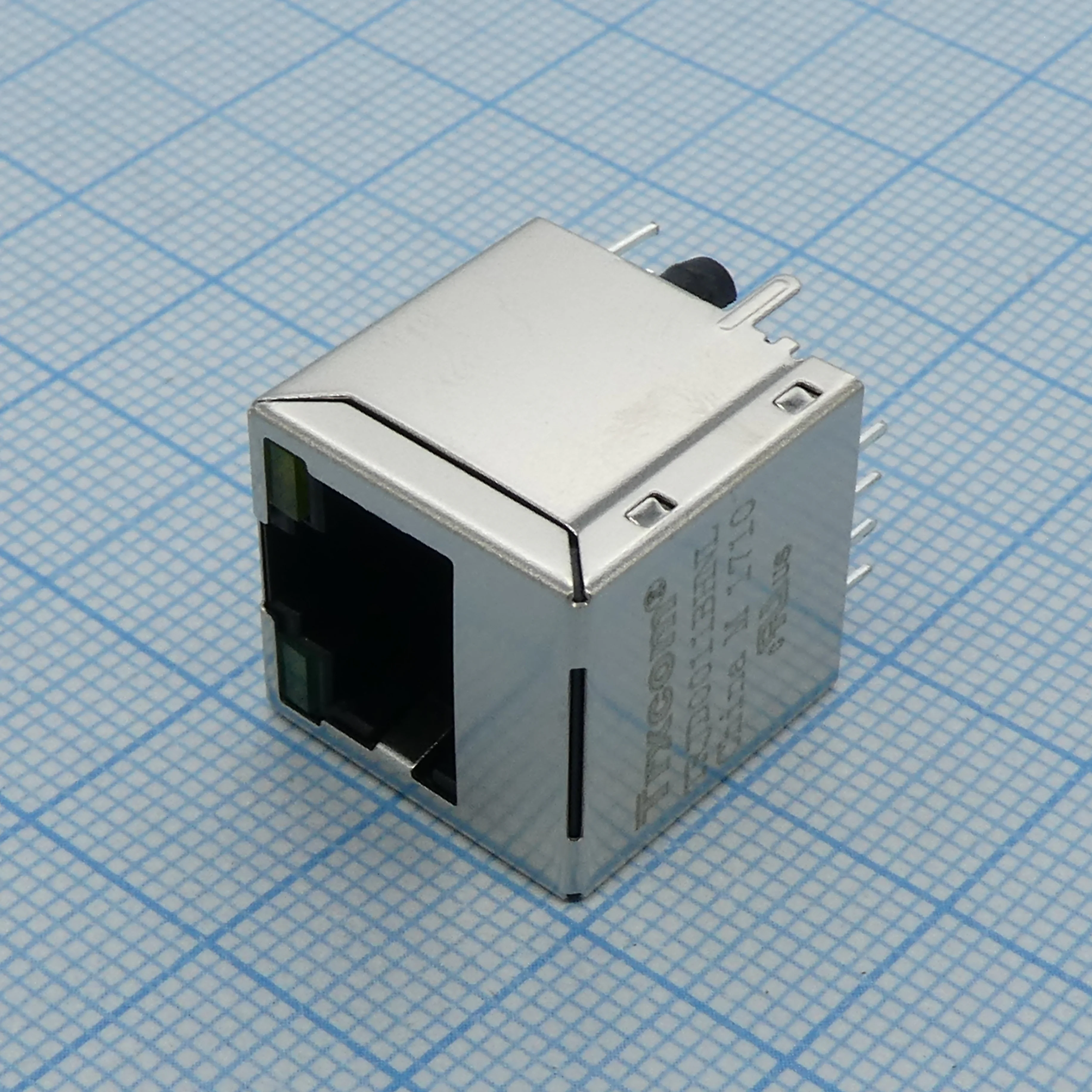 TRJD0011BHNL - Разъем экр. "гнездо" RJ-45 c согласующ. фильтром 10/100Base-TX (1:1), вертик. на плату, 2 светодиод. (зеленый/желтый), без лепестков,  0...+70°С