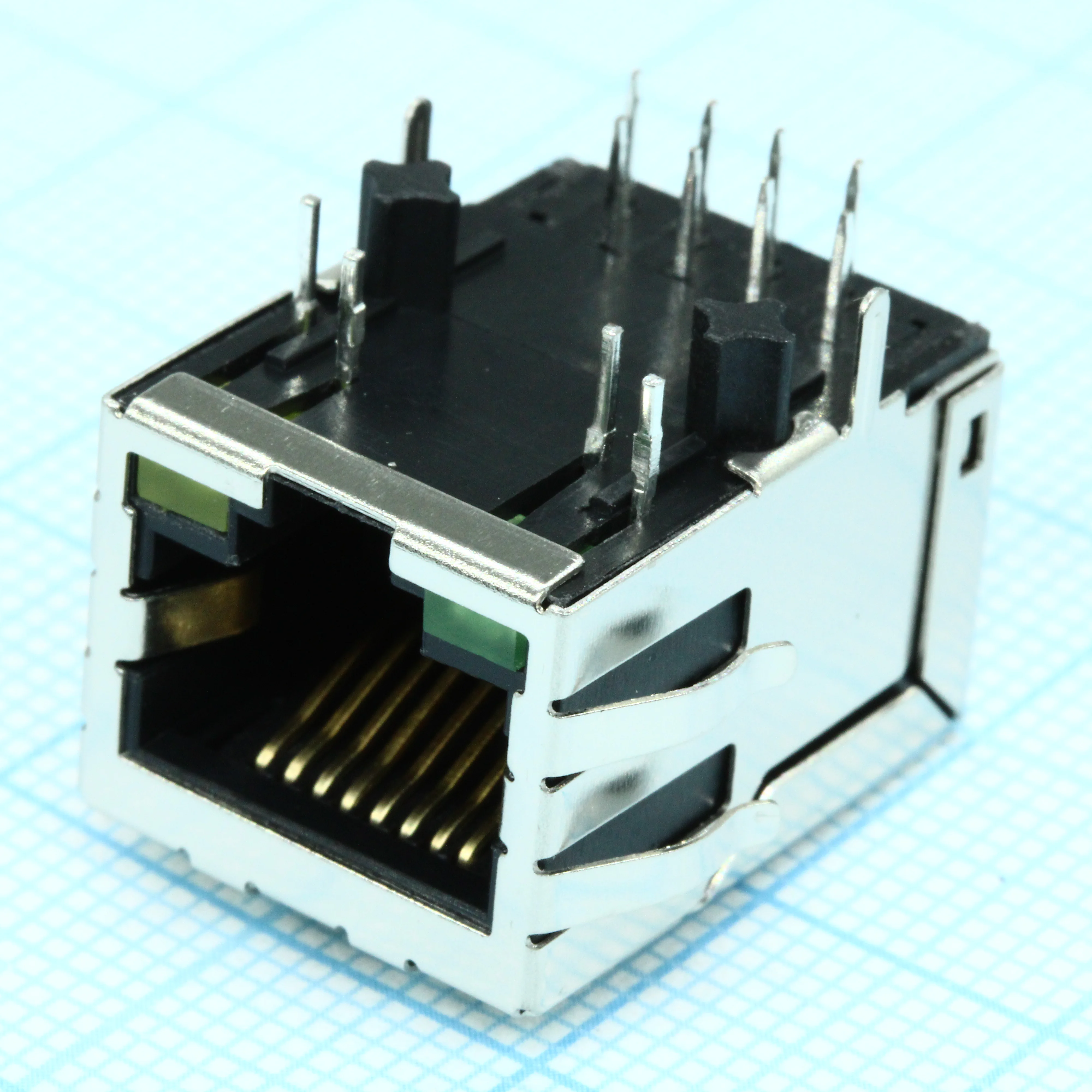TRJ4026ABNL - Разъем экр. "гнездо" RJ-45 c согласующ. фильтром 10/100Base-TX (1:1), 2 нижн. светодиод. (лев.зел./прав.желт.), с лепестк., от - 40 до + 85 гр.C, пр. угол на плату, Lк. = 21.3 мм (аналог J0026D21BNL*/ LU1T516-43*)