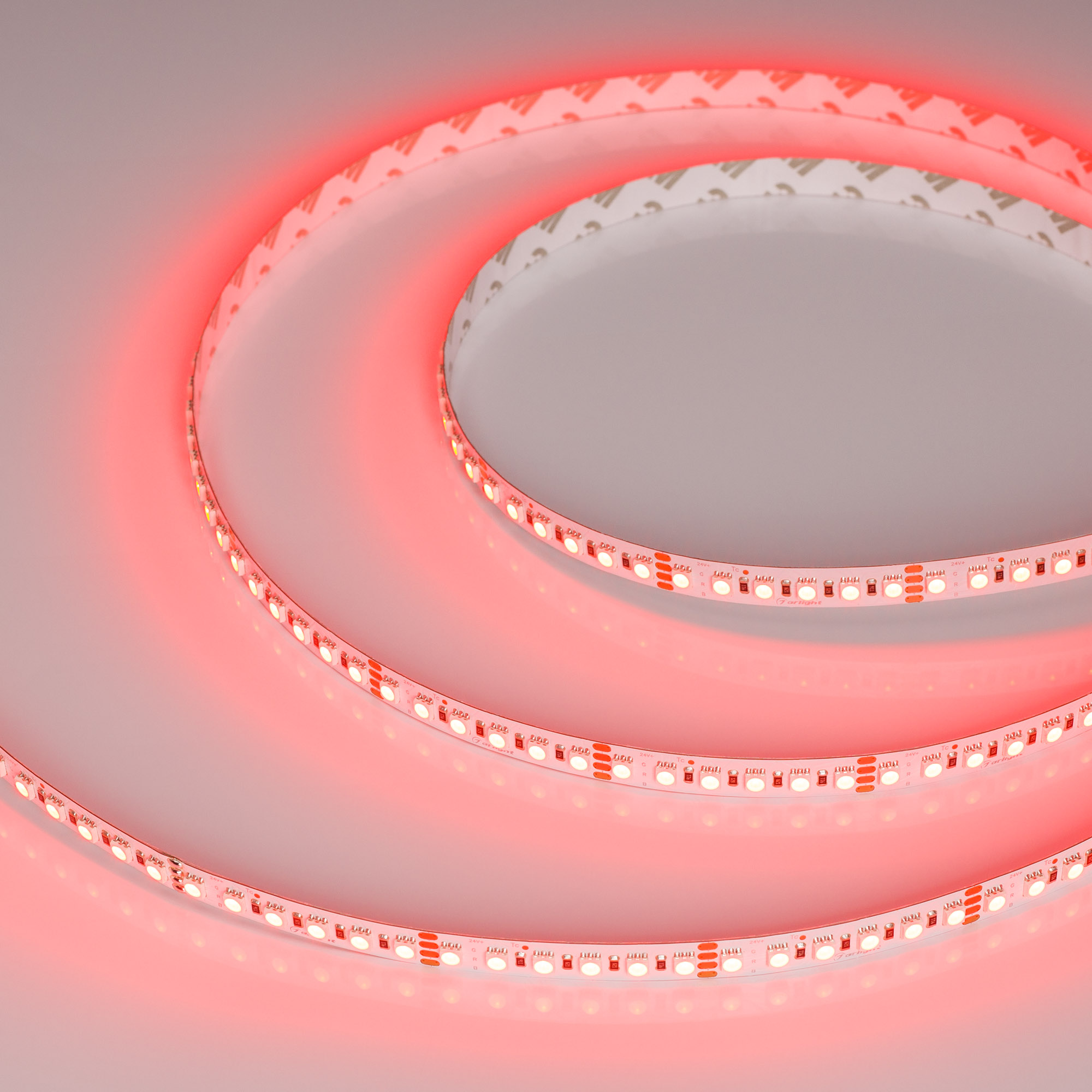 Лента RT-G240-12mm 24V RGB (18 W/m, IP20, 3838, 5m) 028257(2) - Гибкая лента LUX, светодиоды smd 3838, 240шт/м (1200шт на 5м), белая плата 12мм, скотч 3М. Цвет RGB. Питание 24V, мощность 18 Вт/м (90 Вт на 5м), угол 120°. Размеры 5000х12x1.9мм. Мин.отрезок