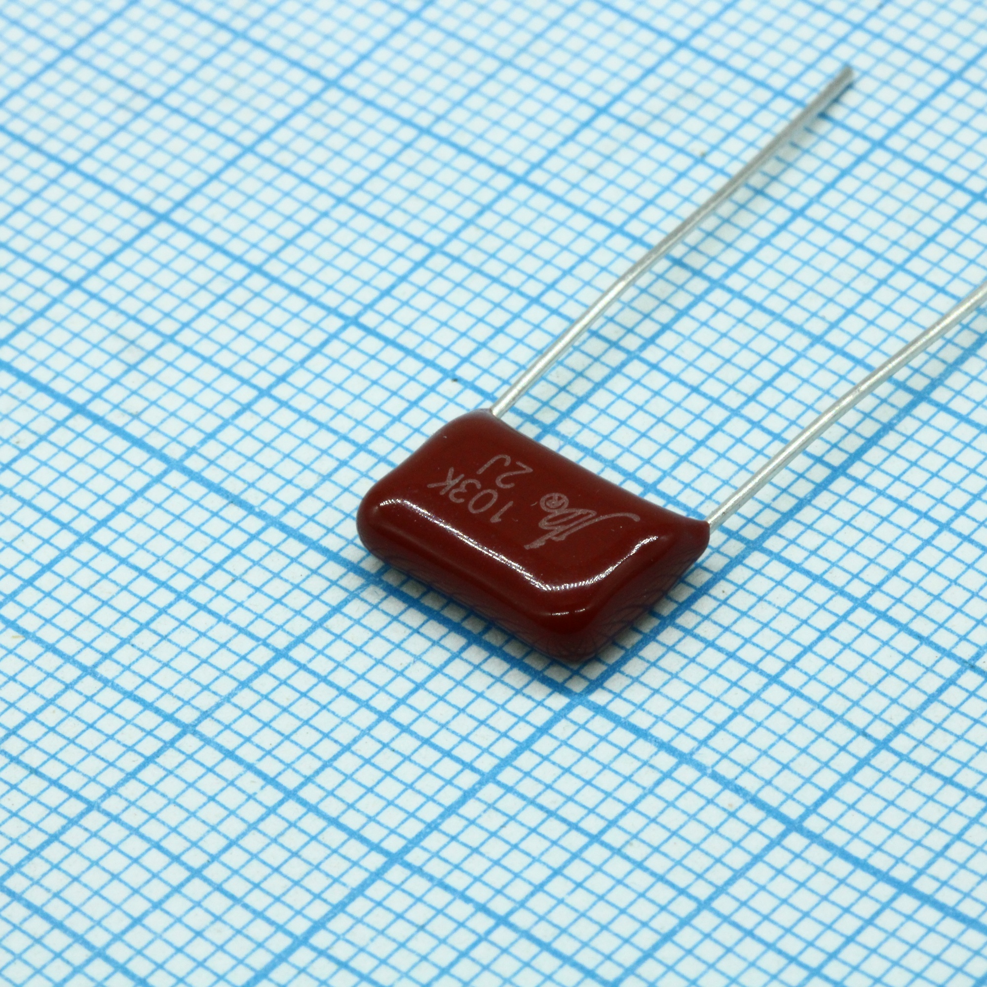 JFB02J103K100000B - Конденсатор металлоплёночный полиэтилентерефталатный 0.01мкФ 630В ±10% (14х4.8х9мм) шаг выводов 10мм 85°С россыпь